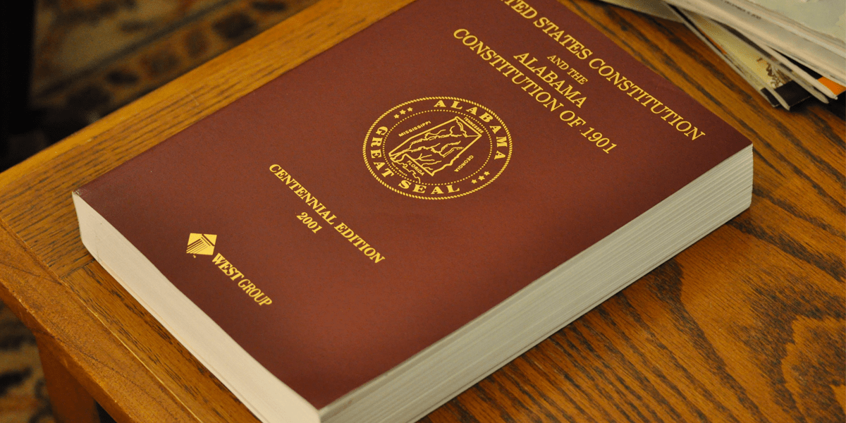 Large book containing the state constitution