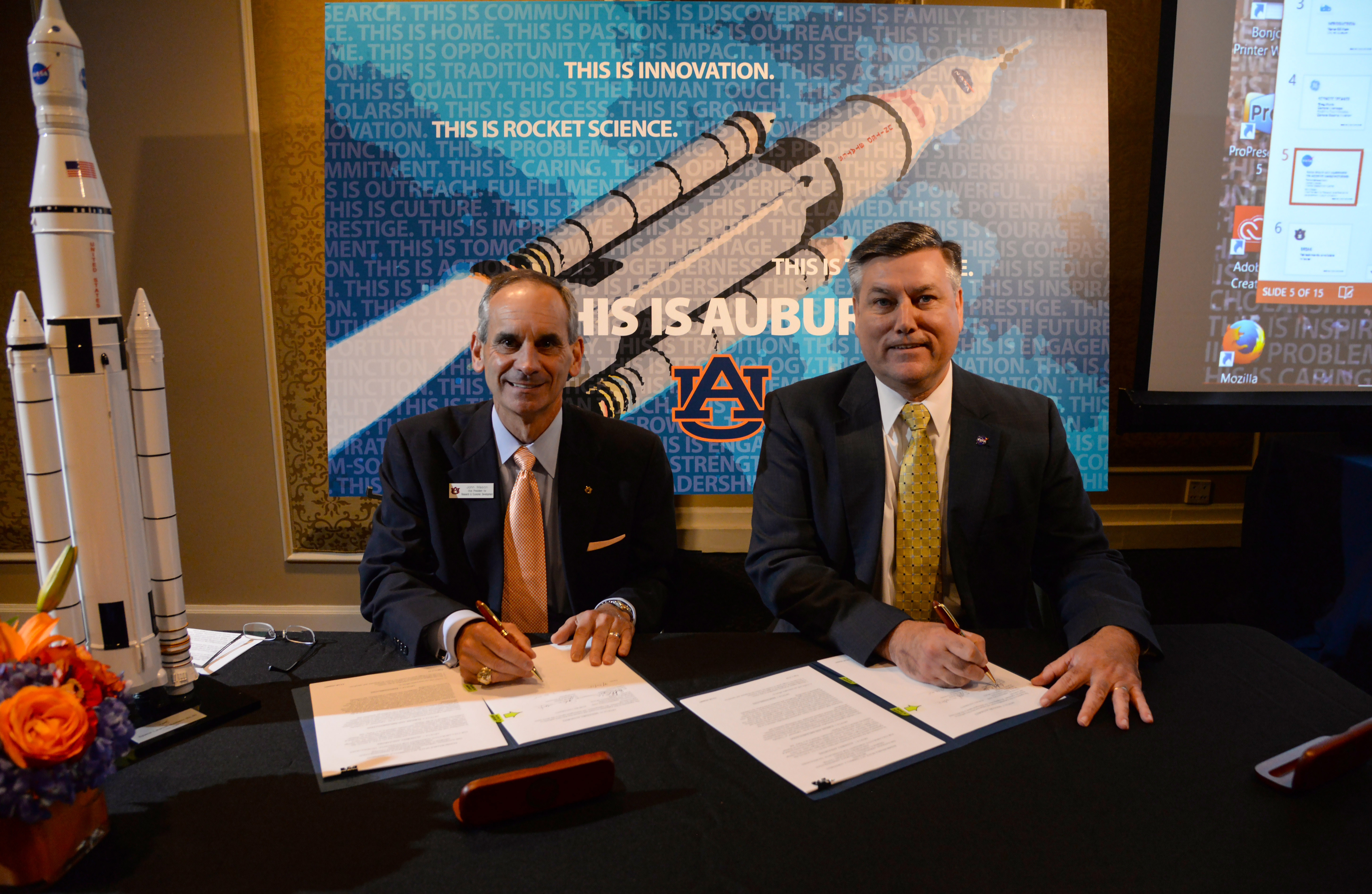 John Mason signing NASA agreement