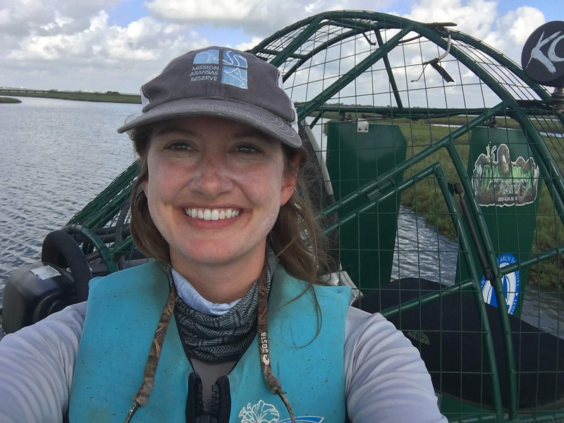 Kelly Dunning aboard airboat on waterway