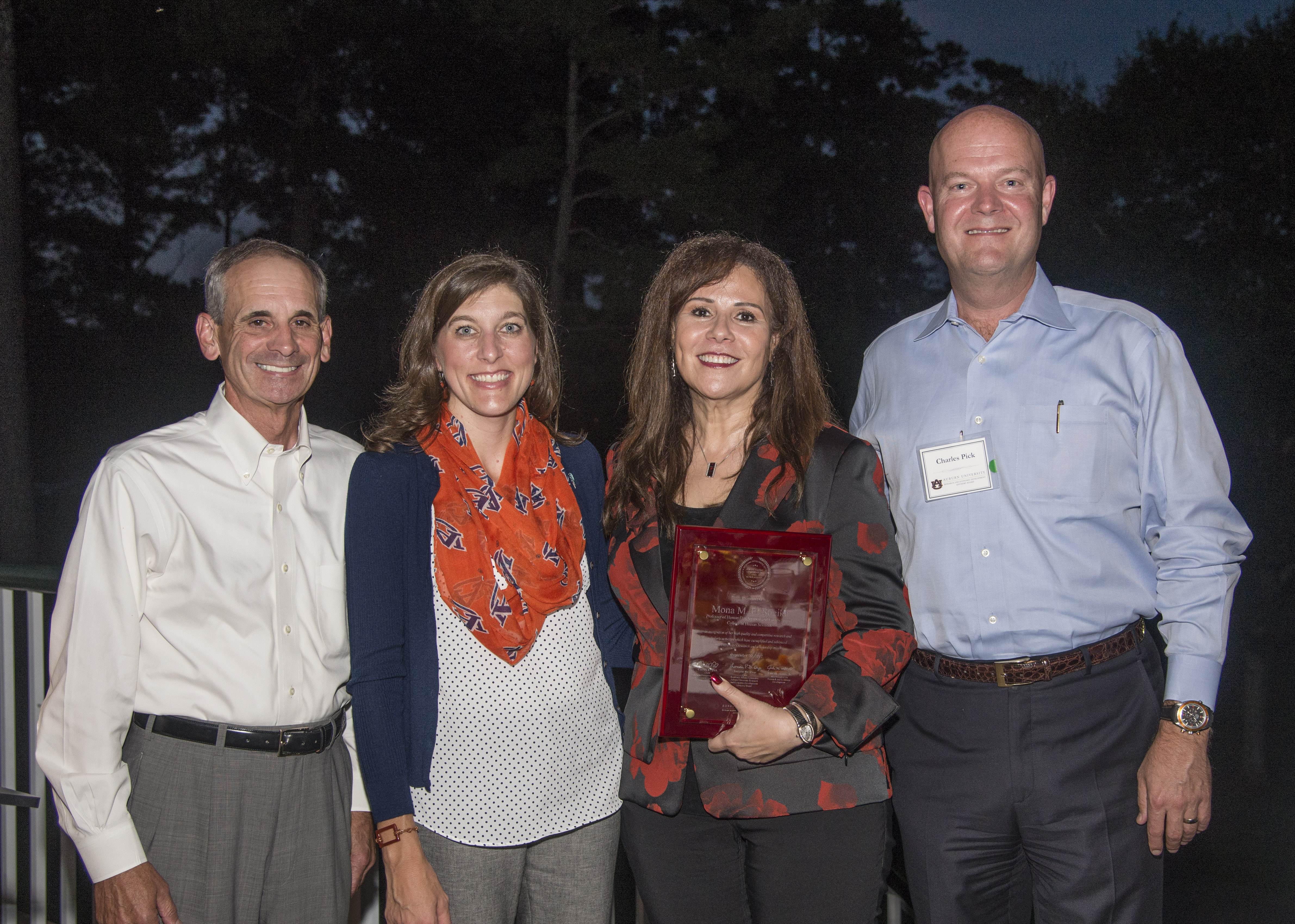 Dr. Mona El-Sheikh holds a plaque recognizing her as recipient of Auburn University's 2017 Research and Economic Development Advisory Board Advancement of Research and Scholarship Achievement Award. Also pictured: Dr. John Mason, vice president for research and economic development; Dr. Lori St. Onge, board member; and Charles Pick, board member.