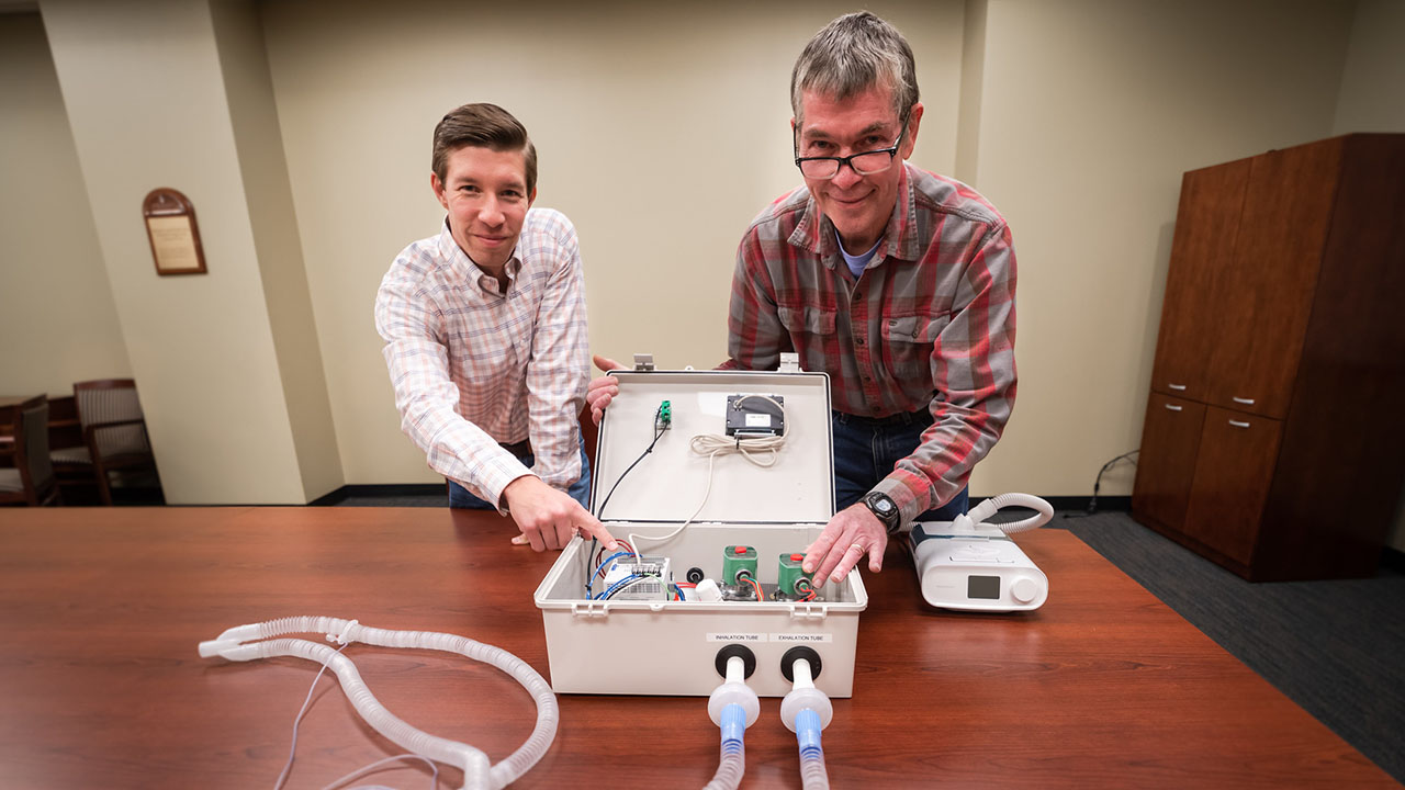 Michael Zabala and Tom Burch with CPAP machine converted to ventilator
