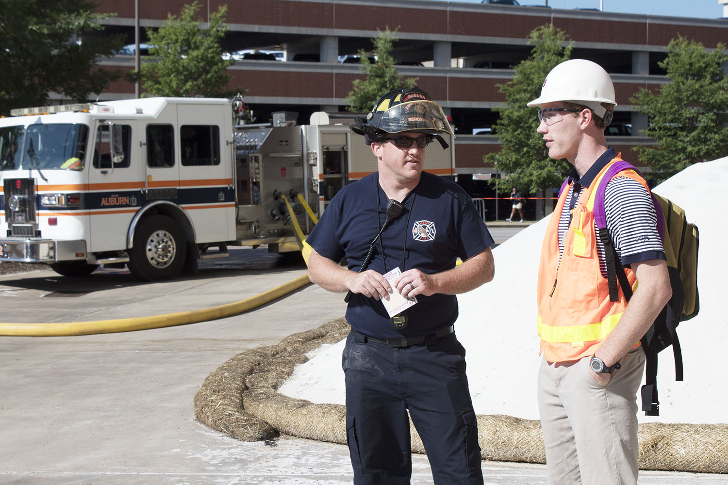 Intern Eric Sutliff with Auburn Fire Division firefighter