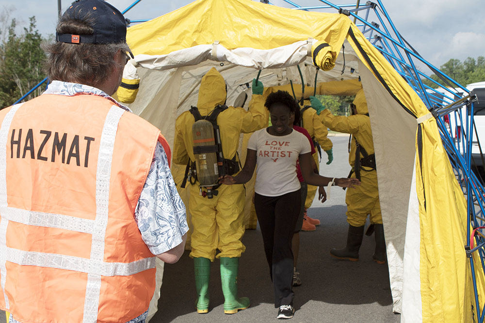 RMS HAZMAT help students through decon tent