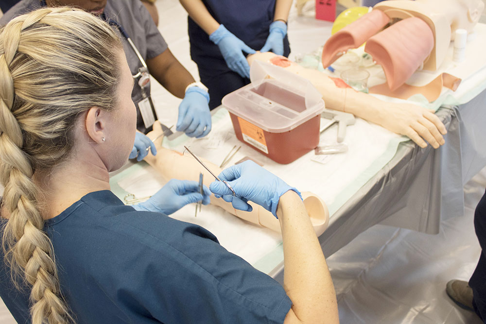 Students perform medical techniques 